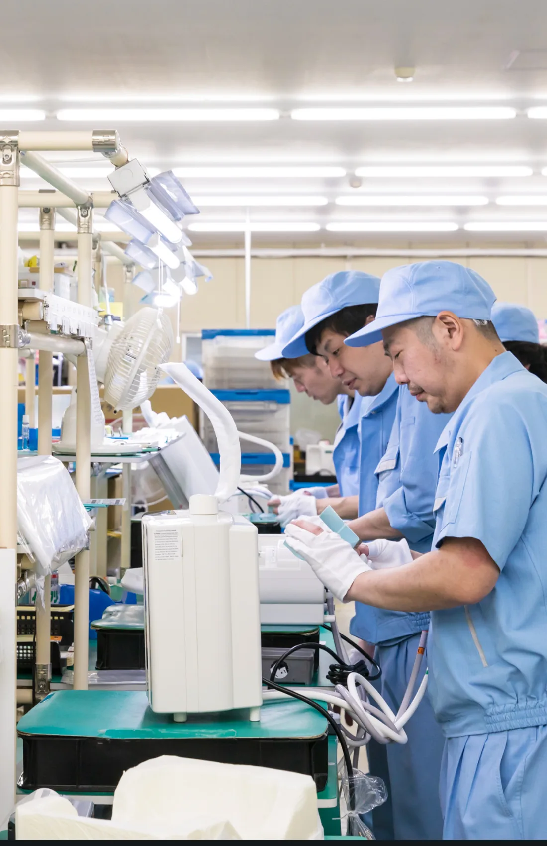 Workers assembling Kangen Water machines by hand at Enagic’s factory in Japan